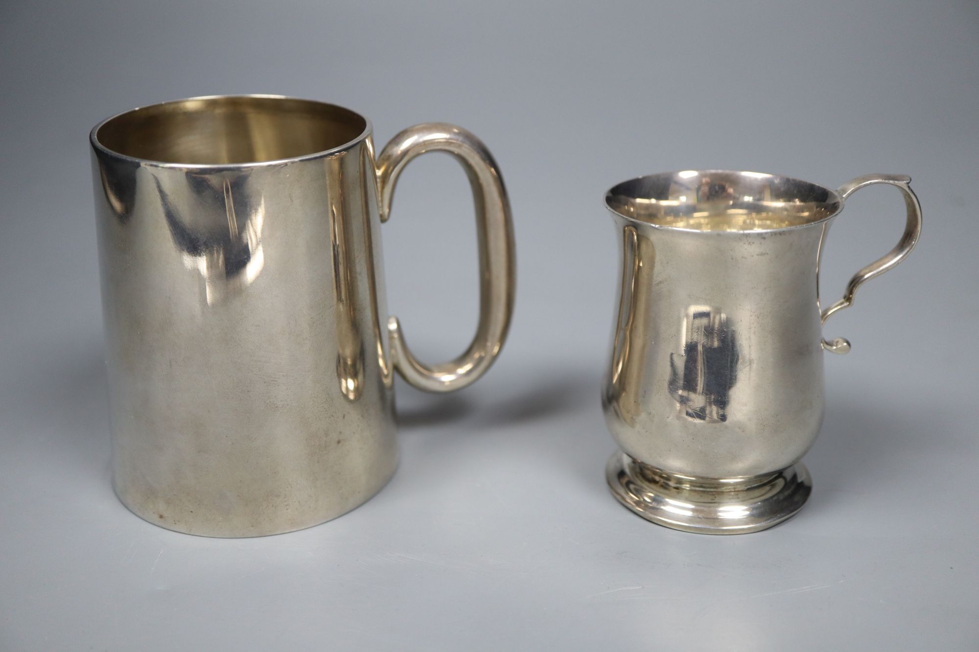A Victorian silver christening mug, 89mm and an Edwardian silver christening mug, 76mm, gross 7.5 oz.